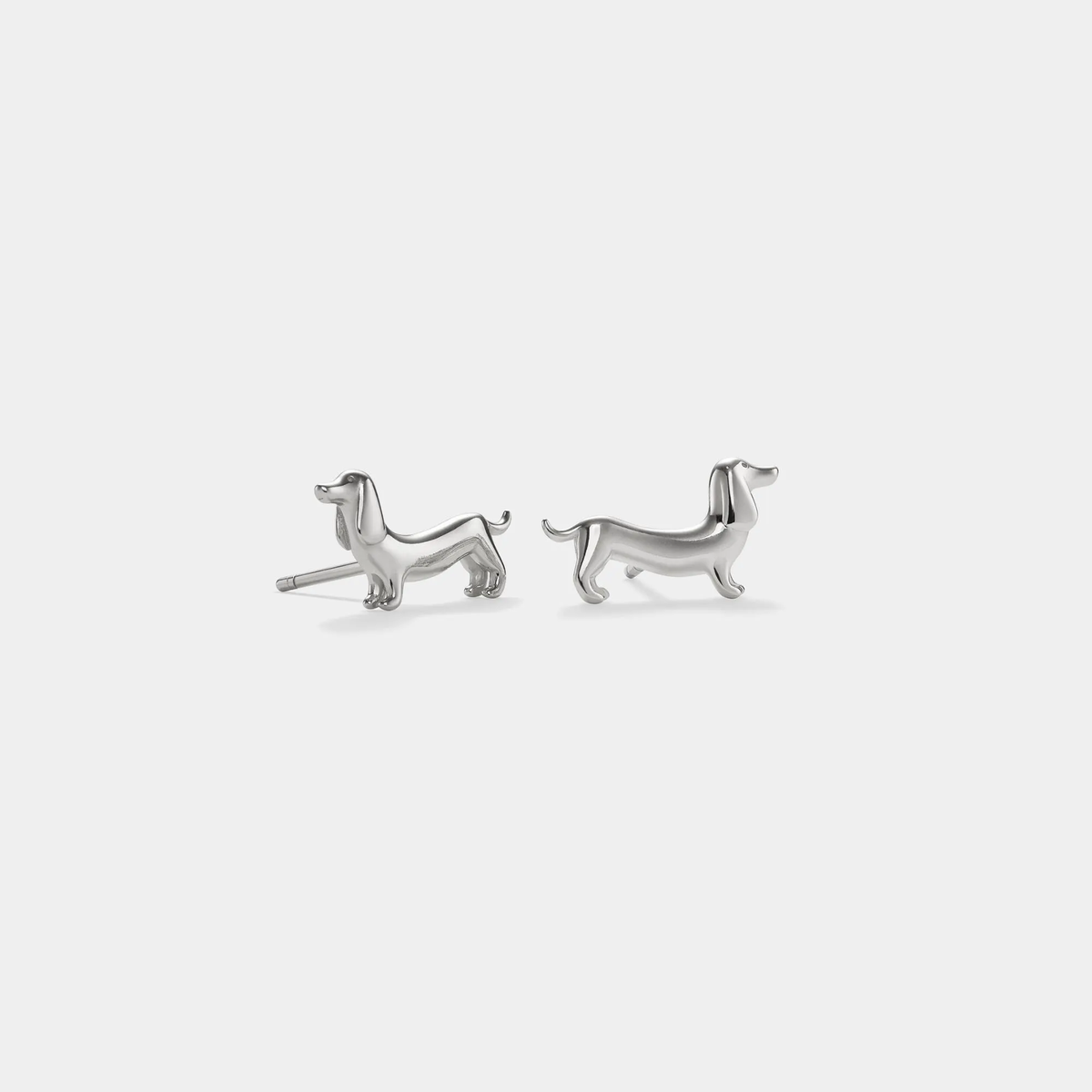 Silver-tone dachshund stud earrings shown as a pair.