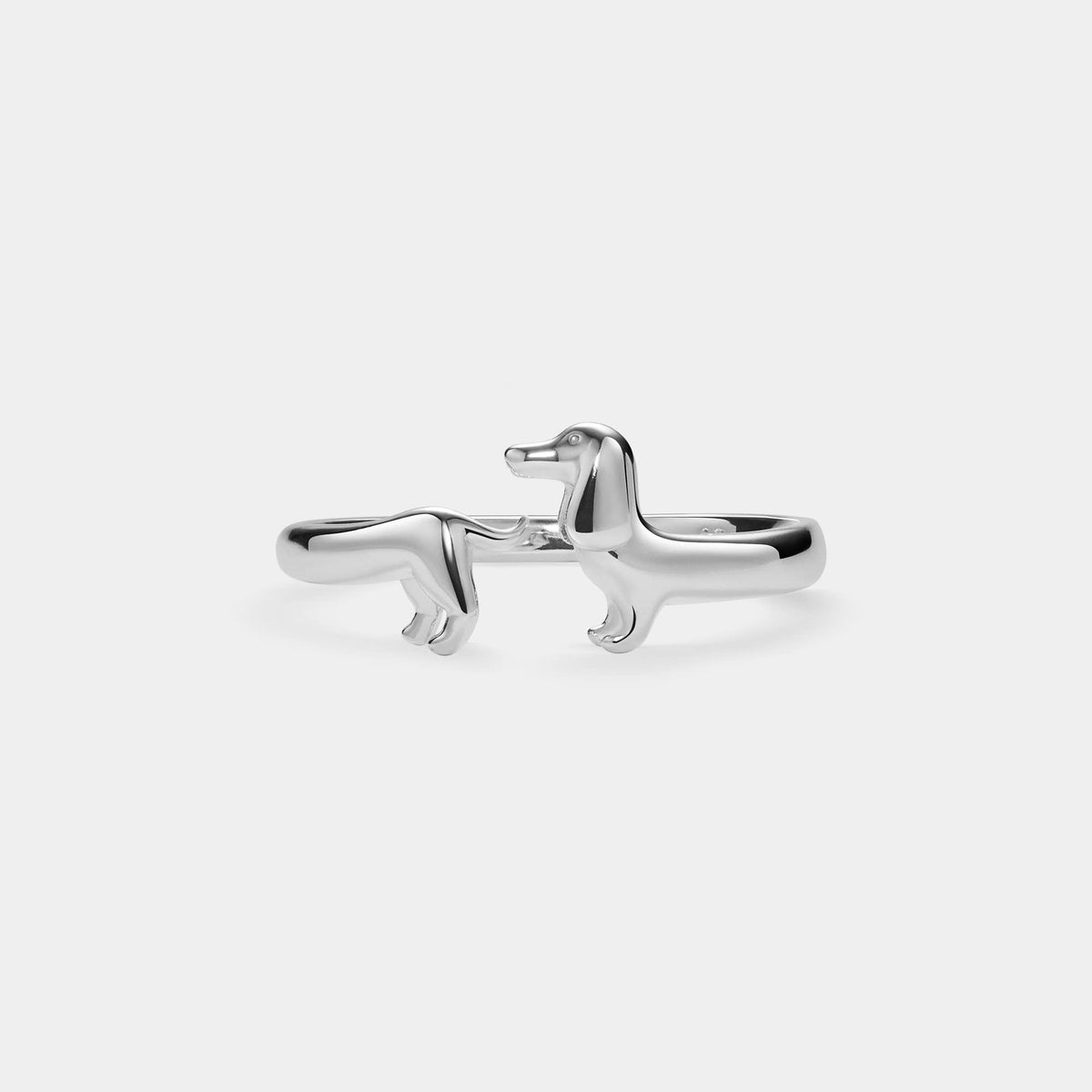 Silver-tone dachshund stacking ring on a white background.