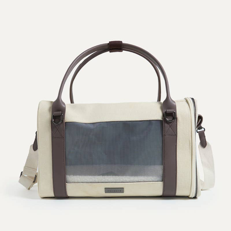 Pet carrier with transparent side panels on a white background